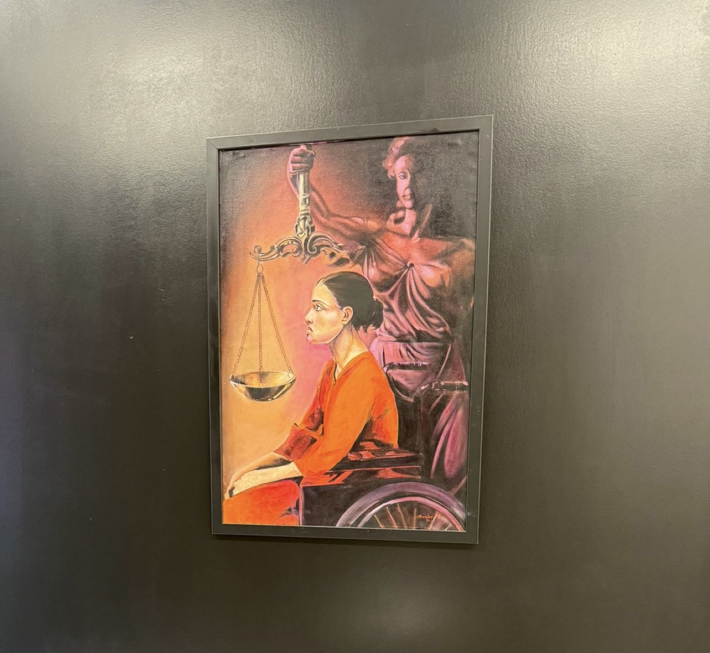 Justice-themed artwork on display at the Kwilu Law Chamber office